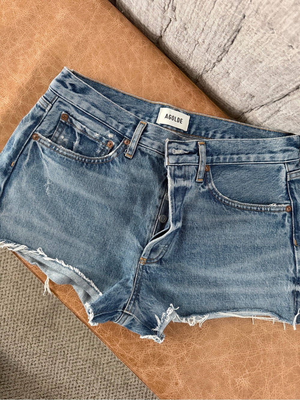 Agolde Medium Wash Denim Cutoff Shorts with Frayed Hem
